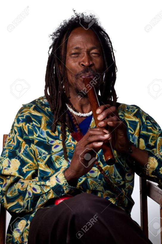 6911907-man-plays-a-traditional-wooden-flute-studio-image-stock-photo